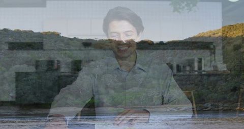 Businessman riverside double exposure conveying tranquil focus and reflective workspace
