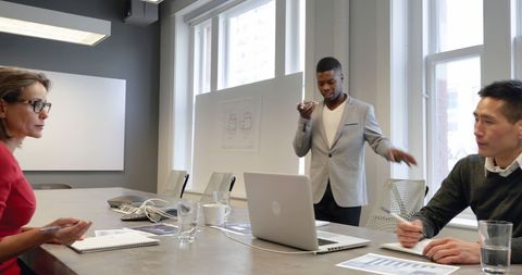 Diverse Team Engaging in Business Meeting at Modern Office