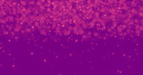 Pink particles falling on purple background