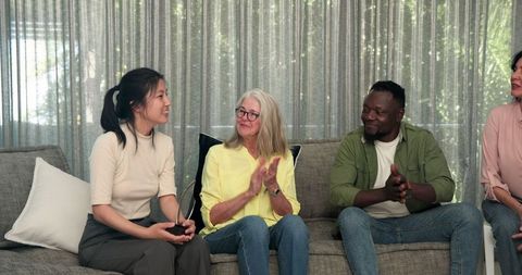 Diverse Group in Therapy Session Engaging in Discussion