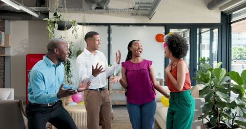 Team celebrating office success vibrant atmosphere