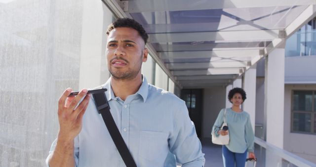 Man Walking and Using Voice Commands on Smartphone - Download Free Stock Images Pikwizard.com