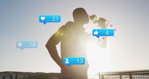 Silhouette of Athlete Hydrating with Social Media Notifications