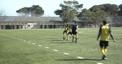 Soccer Player in Action Focusing on Ball Control During Match