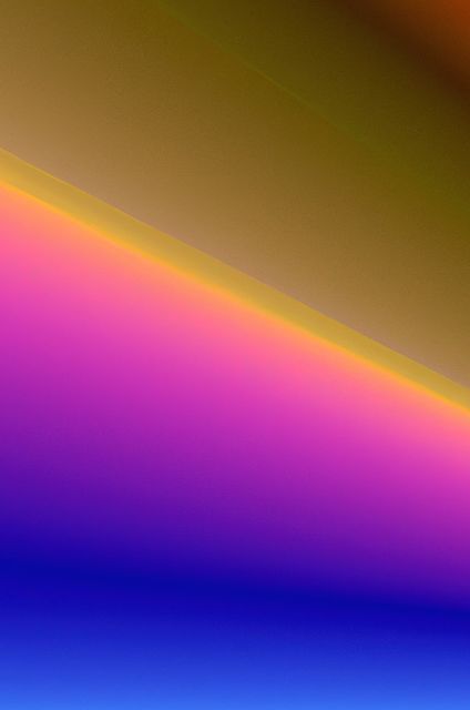 Abstract image featuring a vivid gradient of colors blending from yellow to pink and blue. Ideal for use in modern digital designs, web backgrounds, presentations, graphic design projects, and creative artwork requiring bright, eye-catching elements.
