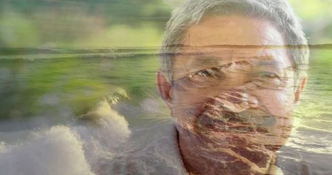 Senior man double exposure with ocean waves and coastal horizon conveying calm reflection