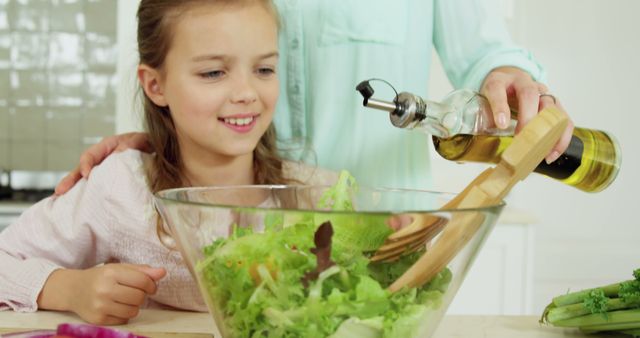 Mother and Daughter Preparing Nutritious Salad Together in Kitchen - Download Free Stock Images Pikwizard.com