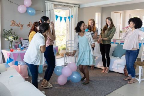 Happy Friends Celebrate with Dance at Joyful Baby Shower Gathering