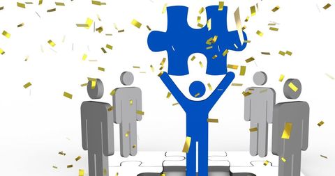 Team Celebrating Success as Puzzles Fit Together Perfectly