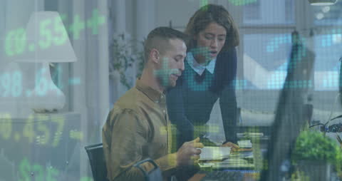 Business Professionals Analyzing Financial Data on Monitors