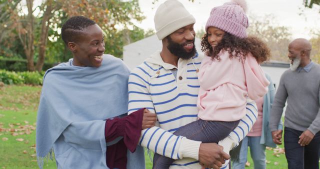 Happy African American Family Walking in Garden with Grandparents in Background - Download Free Stock Images Pikwizard.com