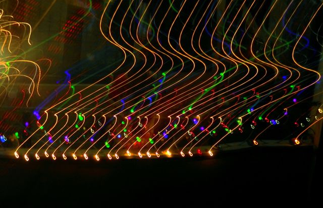 Abstract light trails creating dynamic patterns in dark background - Download Free Stock Photos Pikwizard.com