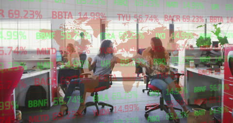 Diverse Businesswomen Collaborating in Office with Financial Data Overlay