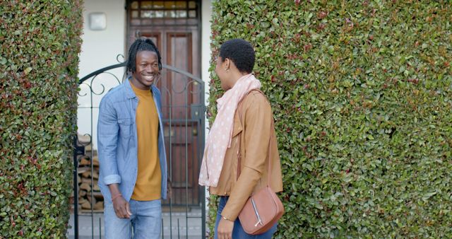 Happy African American couple meeting at garden gate - Download Free Stock Images Pikwizard.com