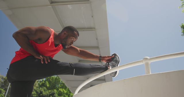 Athletic Man Stretching Outdoors in Urban Environment - Download Free Stock Images Pikwizard.com