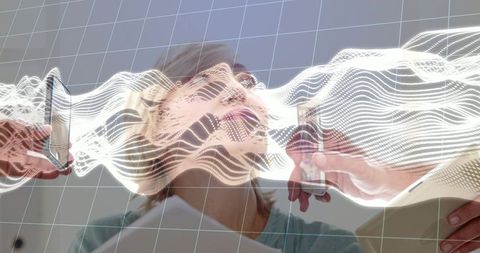 Senior woman undergoing neurological scanning with augmented reality waveform overlay