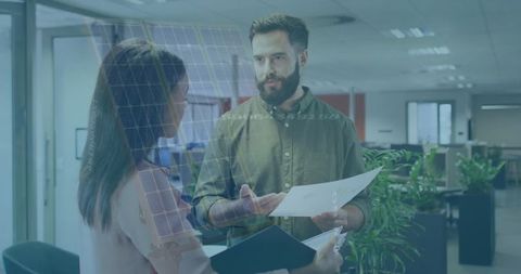 Colleagues Engaged in Productive Discussion in Modern Office
