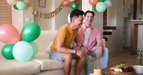 Joyful Birthday Celebration for a Gay Couple in a Modern Living Room