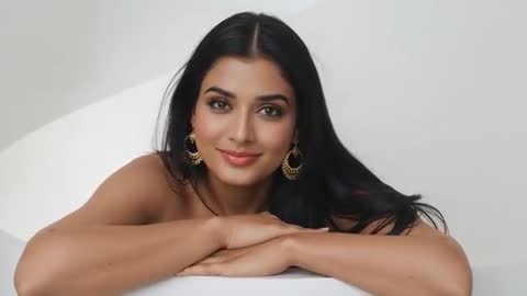 Close-Up of Elegant Model Leaning on Minimalist Surface