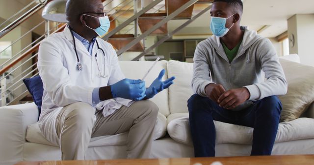 Doctor Wearing Mask Giving Medical Advice to Patient at Home - Download Free Stock Images Pikwizard.com