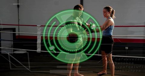 Coach wrapping trainee hand wraps boxing ring with green hud overlay for sports tech