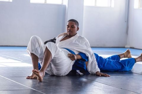 Training Partners Sparring in Martial Arts Studio Practice Grappling