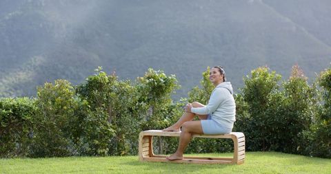 Woman enjoying serenity in scenic mountain setting