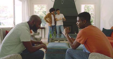 Friends Relaxing and Chatting in Cozy Living Room Gathering