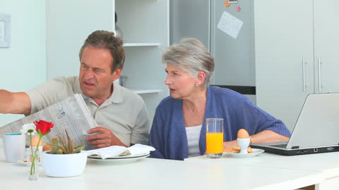 Senior Couple Having Breakfast Together at Home