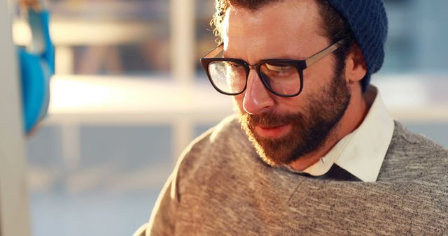 Focused Man with Glasses Working at Desk in Natural Light - Download Free Stock Images Pikwizard.com