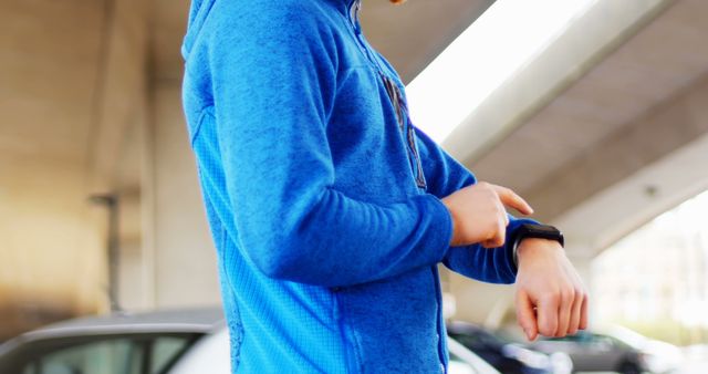 Person Checking Fitness Tracker During Workout in Urban Setting - Download Free Stock Images Pikwizard.com