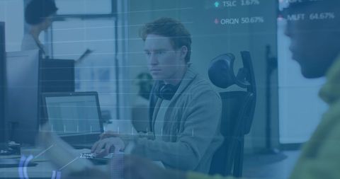 Focused Businessman Analyzing Financial Data in Modern Office