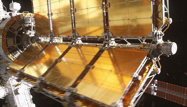 Gold Segmented Solar Array Reflecting Sunlight on Spacecraft Truss and Docking Node in Orbit