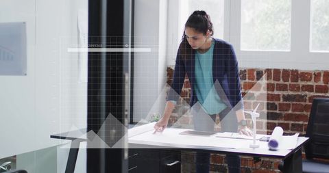 Businesswoman Analyzing Virtual Financial Data in Modern Office - Download Free Stock Images Pikwizard.com