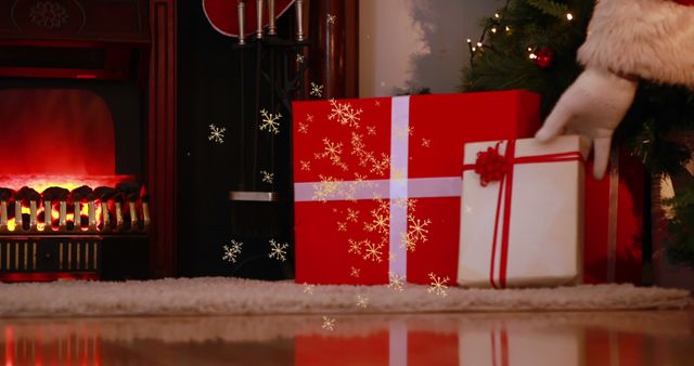 Santa Hand Placing Gift by Fireplace and Christmas Tree - Download Free Stock Images Pikwizard.com