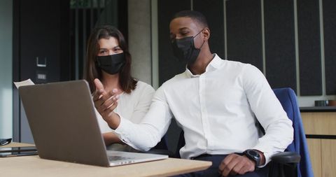 Business Colleagues Discussing Work with Masks in Office - Download Free Stock Images Pikwizard.com