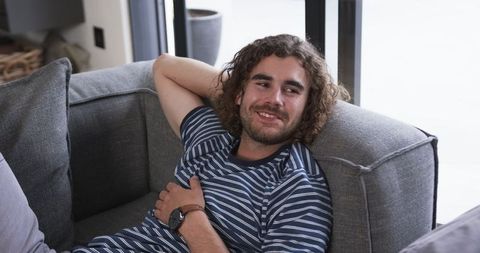 Relaxed Young Man Enjoying Leisure at Home