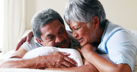 Senior Couple Embracing and Smiling Happily Together