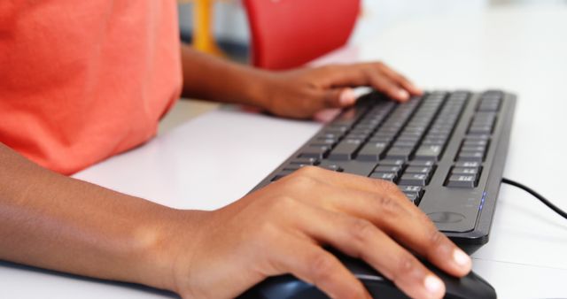 Young Student Typing on Keyboard During Classroom Activity - Download Free Stock Photos Pikwizard.com