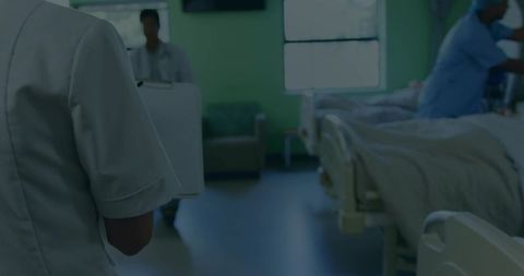 Healthcare Team Discussing Patient in Busy Hospital Ward