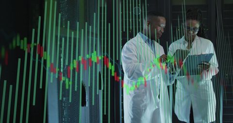 Data Analysts Collaborating in Server Room with Overlay Graph - Download Free Stock Images Pikwizard.com