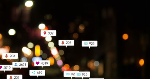 Social media notifications over blurred city lights