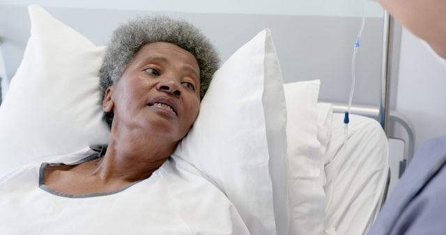 African American Patient Receiving Care in Hospital Bed - Download Free Stock Images Pikwizard.com