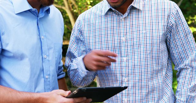 Business Professionals Discussing on Digital Tablet Outdoors - Download Free Stock Images Pikwizard.com