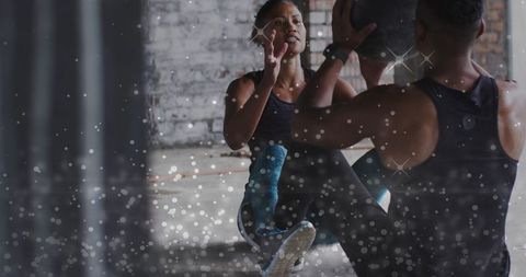 Couple Exercising with Medicine Ball in Urban Fitness Space