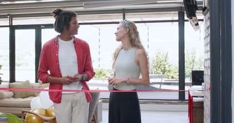 Young professionals celebrating opening in modern office environment