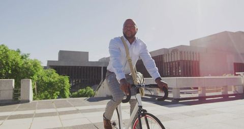 Businessman Enjoying Cycling Commute in Urban Environment