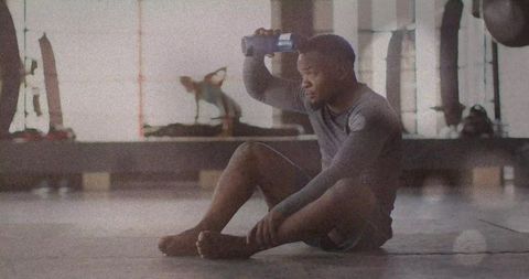 Athlete Cooling Down Relaxing in Gym Post-Workout