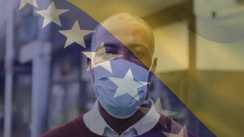 Man with Face Mask Waving Bosnia and Herzegovina Flag Pandemic Impact