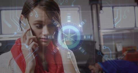 Woman talking on smartphone in open office with holographic hud and circuitry overlay